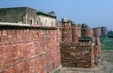 Agra Fort was originally a brick fort, held by the Hindu Sikarwar Rajputs. It was mentioned for the first time in 1080 CE when a Ghaznavide force captured it.<br/><br/>Sikandar Lodi (1488–1517) was the first Sultan of Delhi who shifted to Agra and lived in the fort. He governed the country from here and Agra assumed the importance of the second capital.<br/><br/>After the First Battle of Panipat in 1526, Mughals captured the fort. The victorious Babur stayed in the fort in the palace of Ibrahim and built a baoli (step well) in it.<br/><br/>The emperor Humayun was crowned here in 1530. Humayun was defeated at Bilgram in 1540 by Sher Shah Suri. The fort remained with Suris till 1555, when Humayun recaptured it.<br/><br/>The Hindu king Hem Chandra Vikramaditya, also called 'Hemu', defeated Humayun's army, led by Iskandar Khan Uzbek, and won Agra. Hemu got a huge booty from this fort and went on to capture Delhi from the Mughals. The Mughals under Akbar defeated King Hemu finally at the Second Battle of Panipat in 1556.<br/><br/>Realizing the importance of its central situation, Akbar made it his capital and arrived in Agra in 1558. The fort was in a ruined condition and Akbar had it rebuilt with red sandstone, completing it in 1573.<br/><br/>It was only during the reign of Akbar's grandson, Shah Jahan, that the site took on its current state.